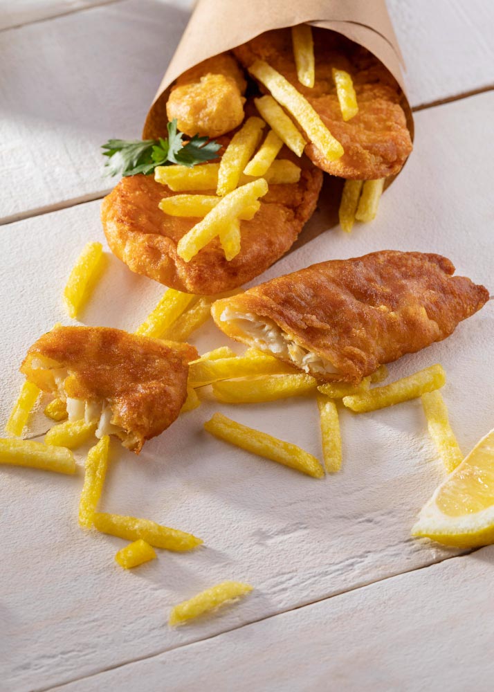 Fresh fish and chips served on paper